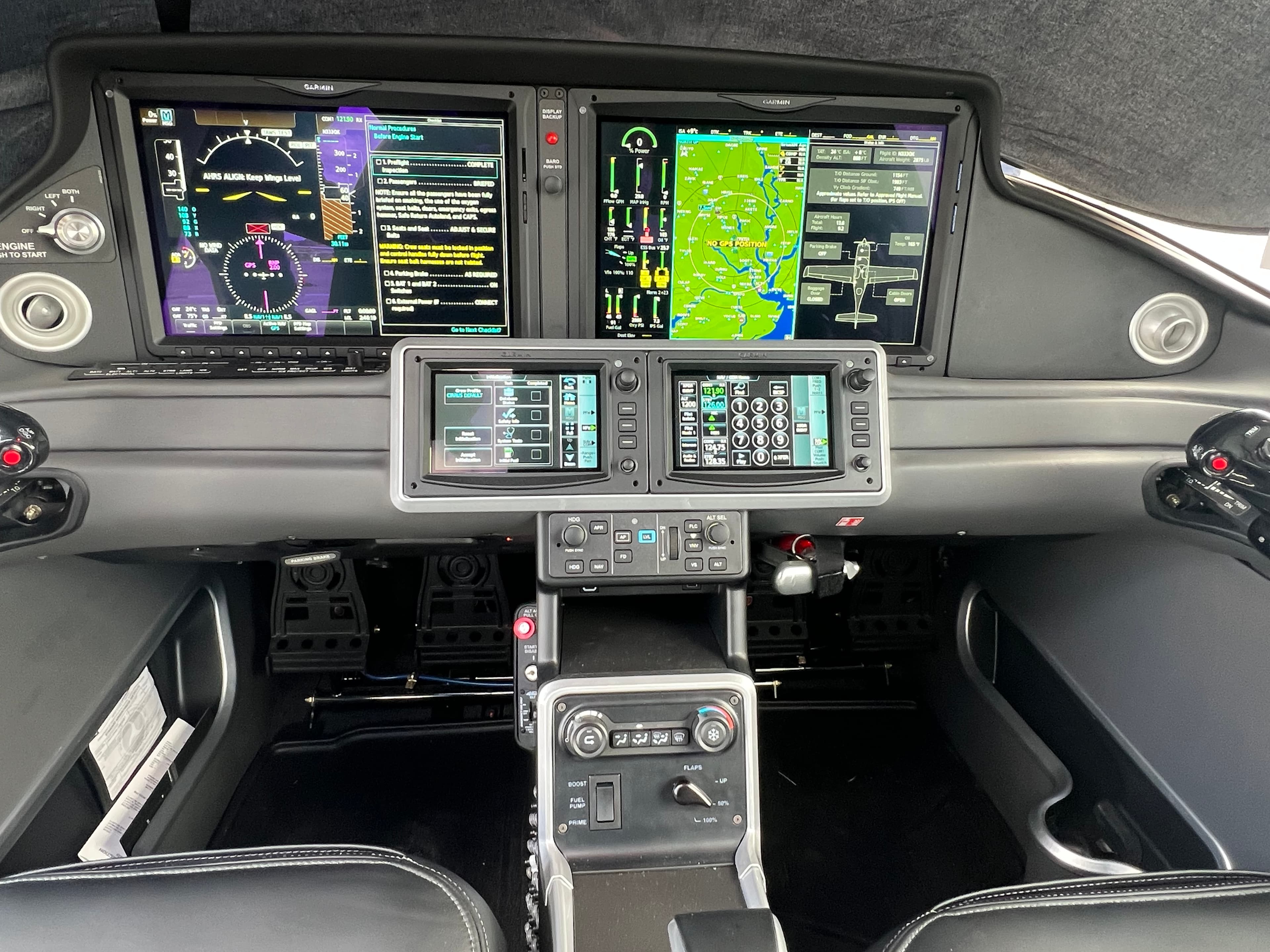 Modern aircraft cockpit featuring a glass flight deck with digital displays and integrated control panels.